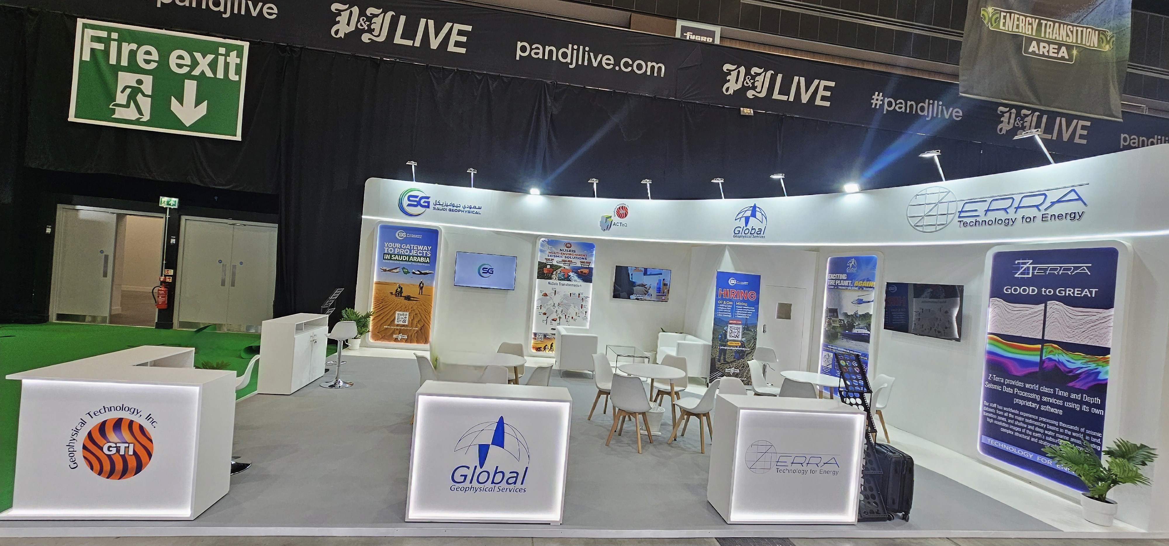 Lucy Electric industrial exhibition pavilion with screens and illuminated booth structure